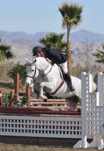 John Bragg and grey mount Riesling on course at the HITS Desert Horse Park.