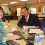 Archie Cox fills out registration forms at the HITS show office.