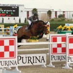 Meredith Michaels-Beerbaum and Cantano clear the checkerboard Purina jump.